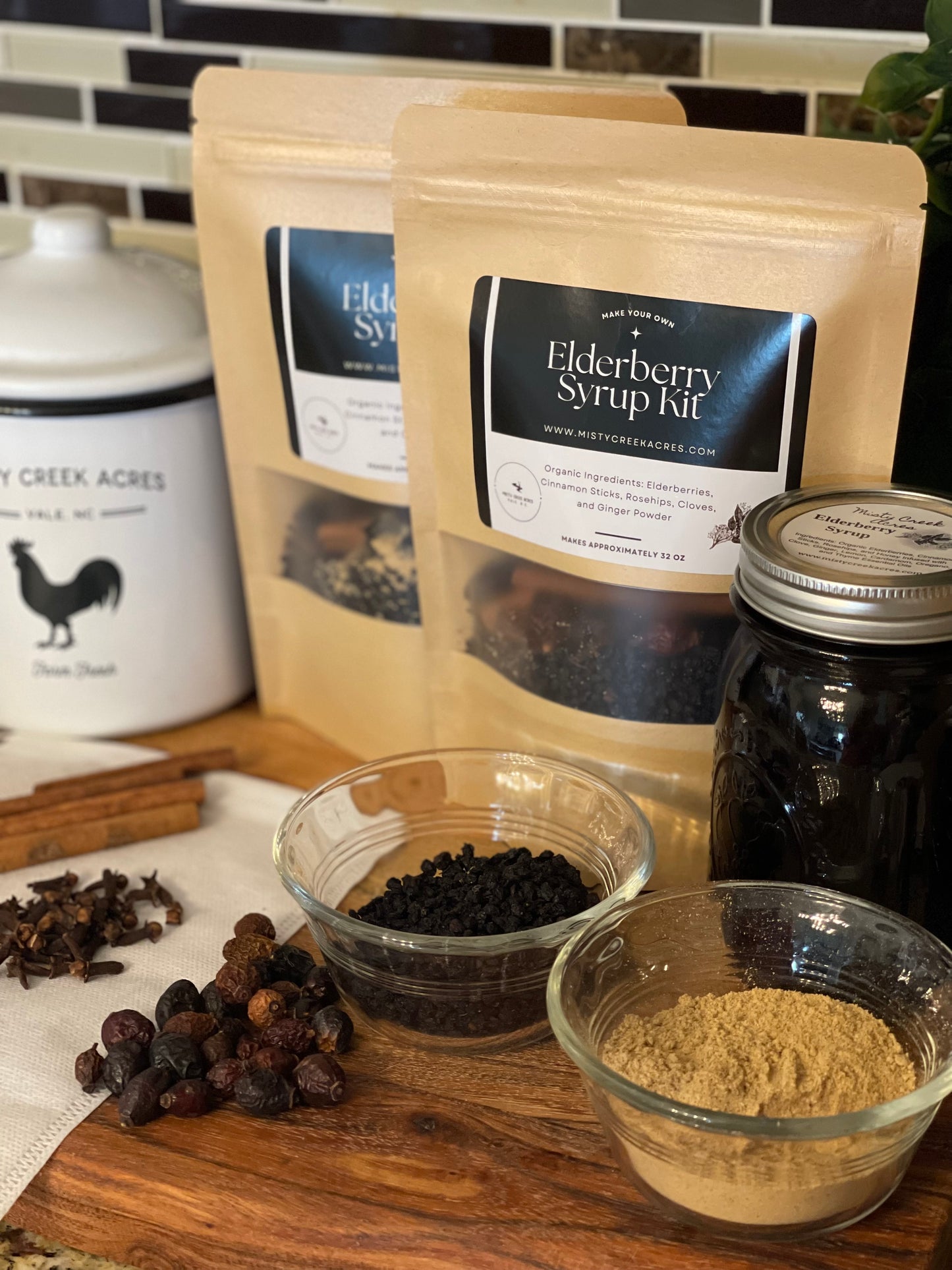 Elderberry syrup kit with ingredients on a wooden surface