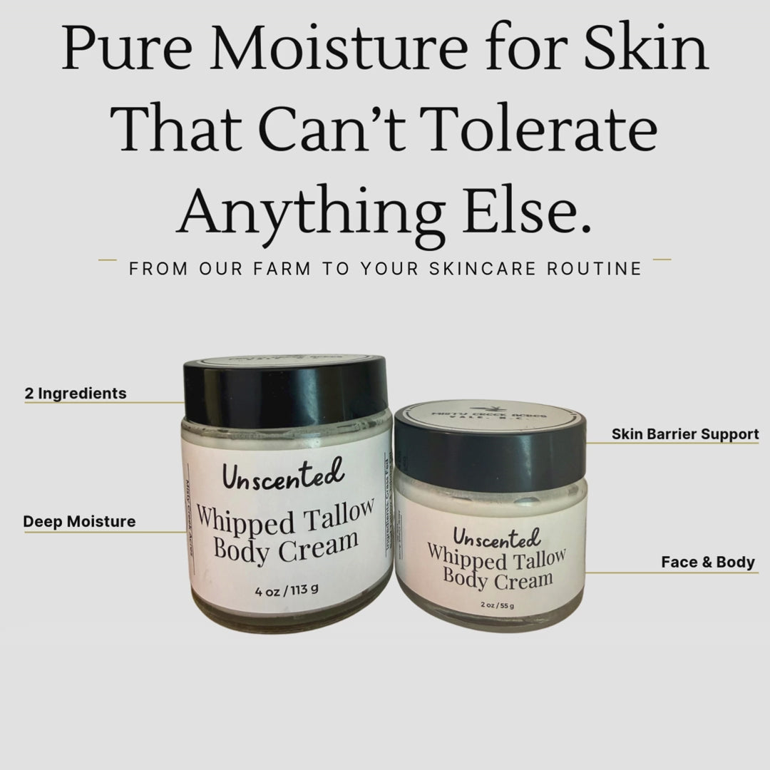 Two jars of unscented whipped tallow body cream on a wooden surface with a white wall background. misty creek acres